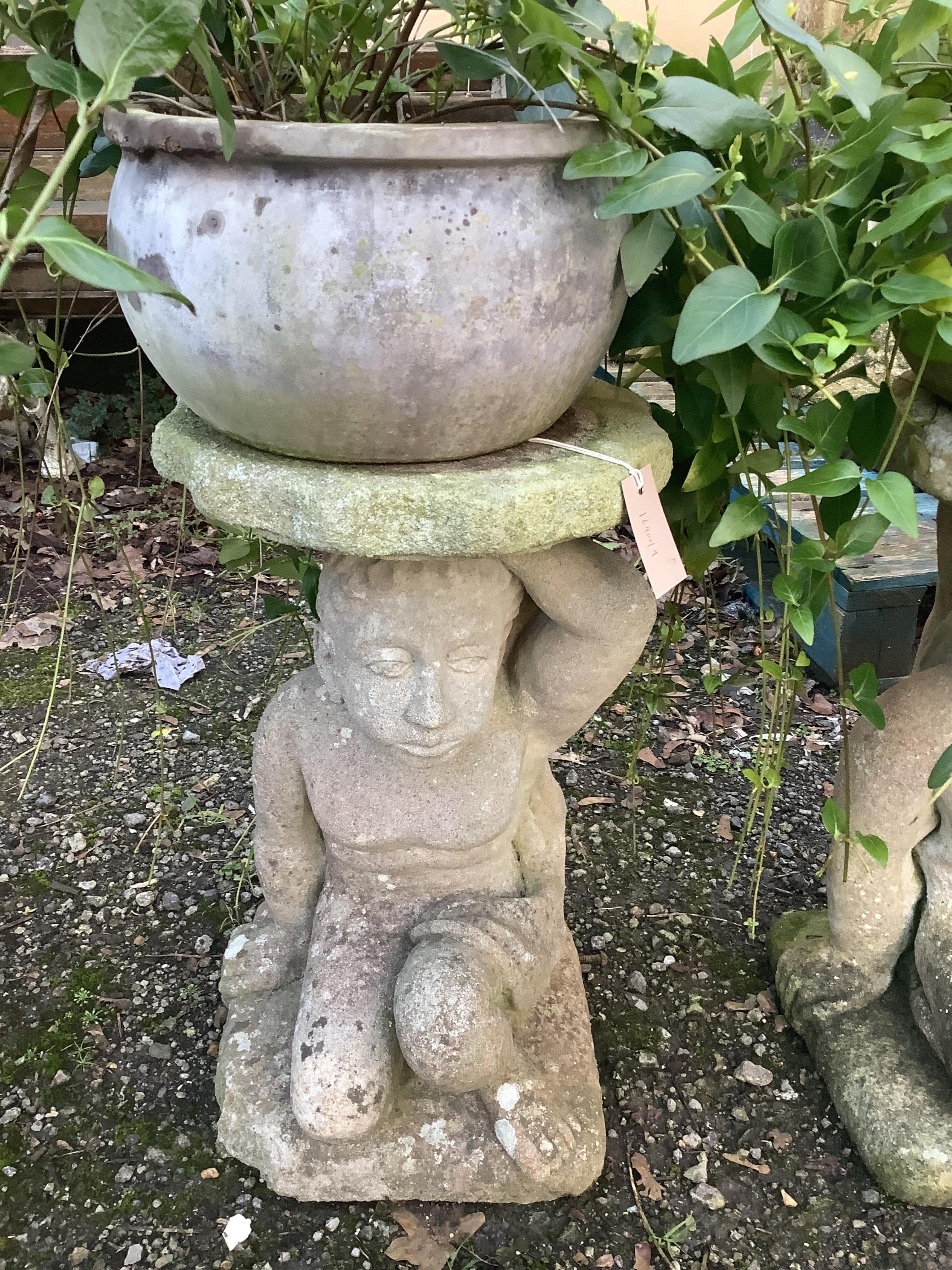 A pair of earthenware garden planters on reconstituted stone figural bases, height 72cm. Condition - fair